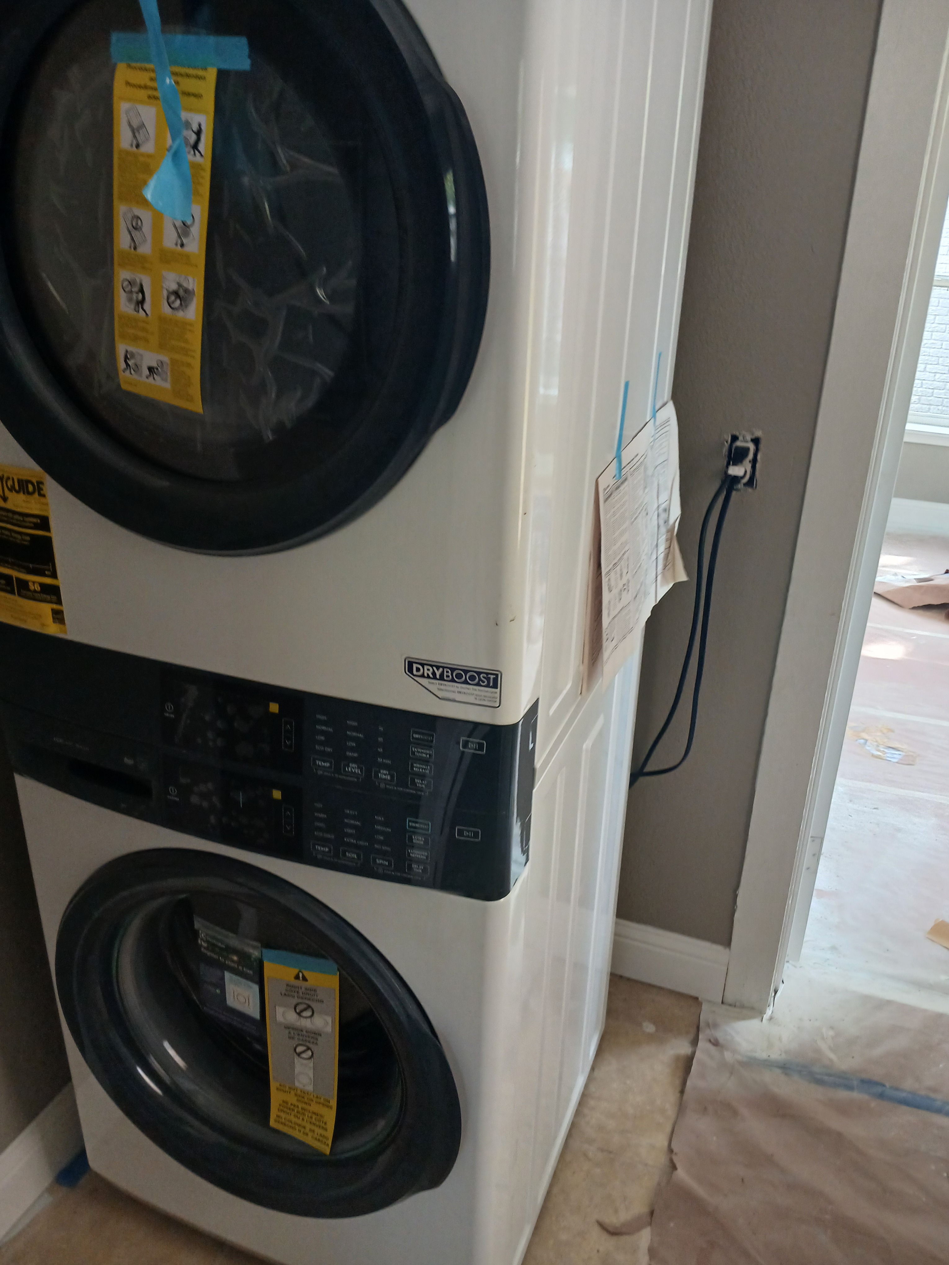 A washer and dryer stacked on top of each other