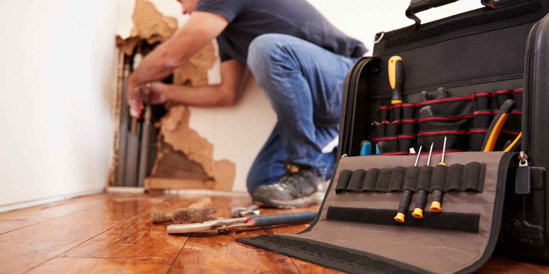 A man is working on a piece of wood